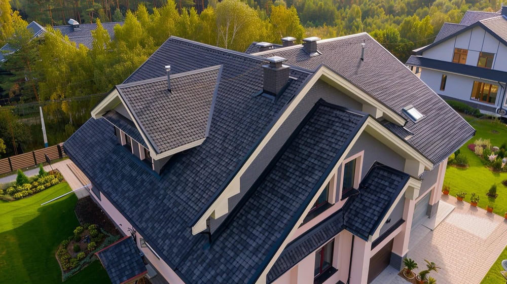 Aerial view of a completed dark shingle roof in Austin