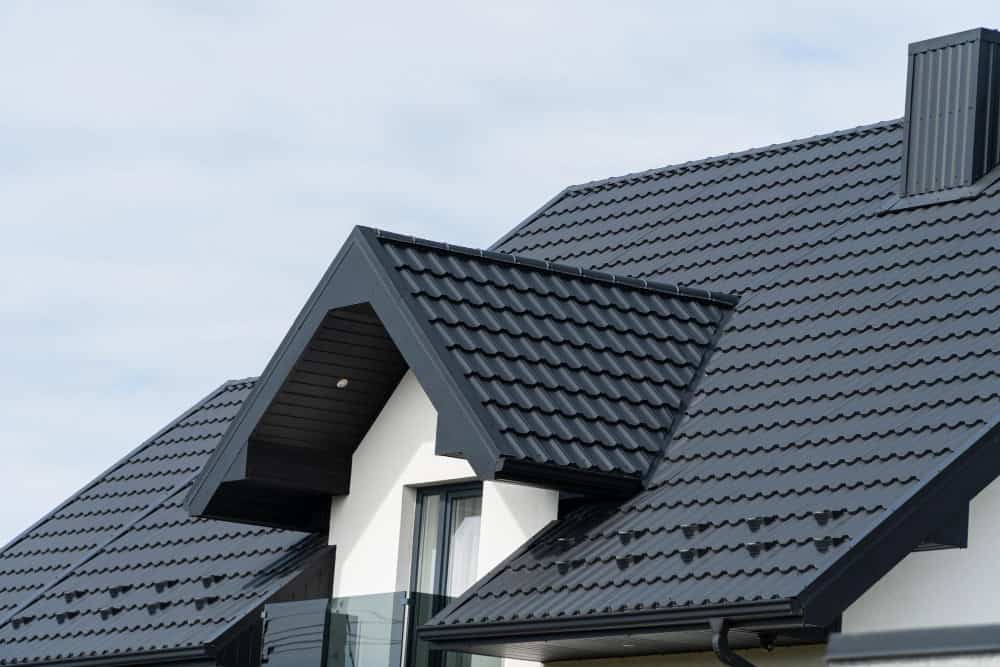 Closeup of a gray tile roof dormer